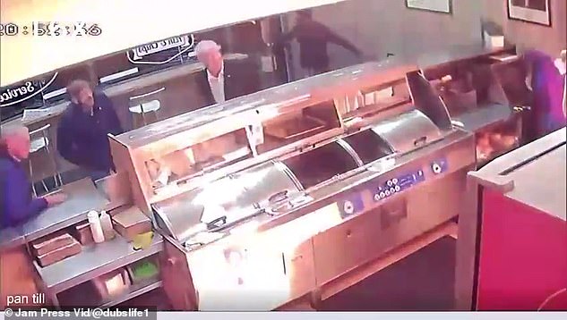 Shocking CCTV footage shows the Molotov cocktail narrowly missed a restaurant worker who was cowering behind the counter at Zia restaurant in Dublin.