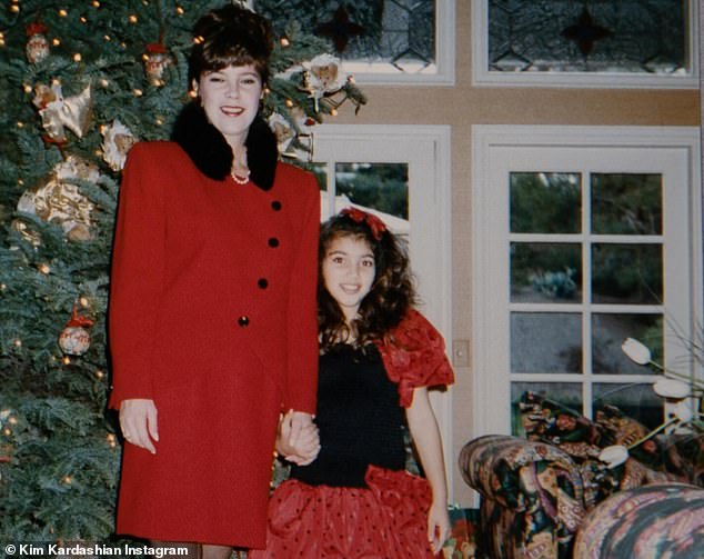 She also posted a sweet photo of her and Karen holding hands as they posed in front of a Christmas tree while wearing matching red and black ensembles.