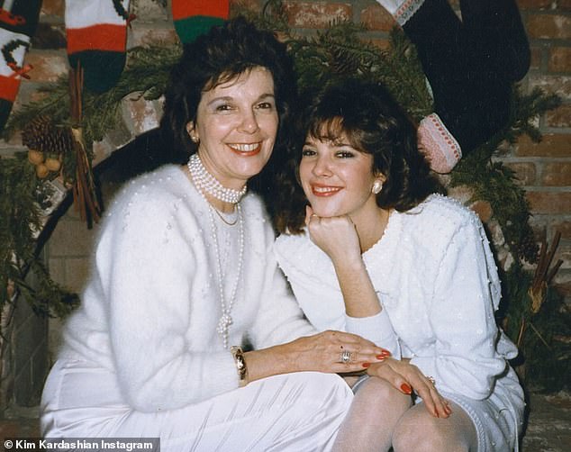 She also posted another Christmas photo of Grandma MJ with Karen as they snuggled up together in front of the fireplace in matching white ensembles.