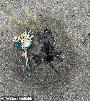 Others have offerings like this small bouquet of flowers next to the animal-shaped imperfection