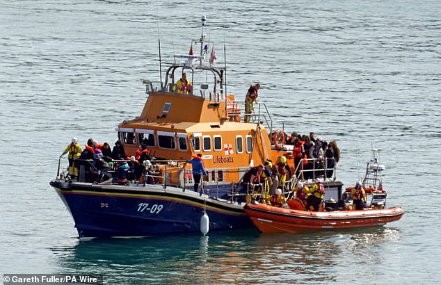 A group of people suspected of being migrants are being brought to Dover on board the RNLI Dover Lifeboat following an incident in the English Channel yesterday.