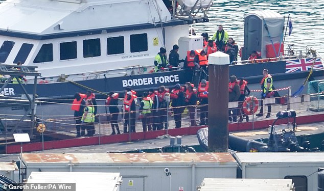 People believed to be migrants were brought by Border Force to Dover, Kent, yesterday morning.