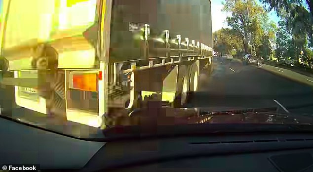 The man can be heard bracing himself as the truck appears directly in front of his vehicle before suddenly changing course (photo).