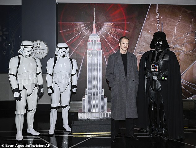 The star cut a dapper figure while posing with Star Wars characters
