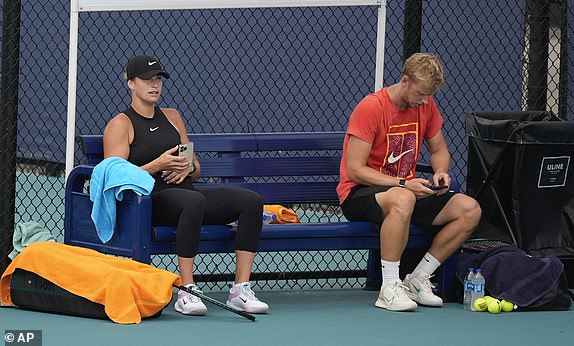 Aryna Sabalenka of Belarus takes a break during a practice session at the Miami Open tennis tournament, Thursday, March 21, 2024, in Miami Gardens, Fla. (AP Photo/Rebecca Blackwell)