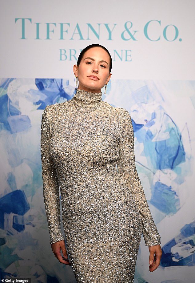 The AFL WAG adorned her figure with a $1,549 sequined Carla Zampatti dress, giving the illusion of a crushed diamond look.