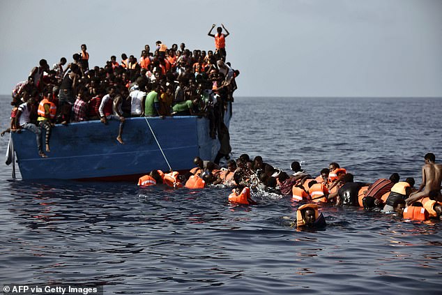 Oumar's first dinghy was captured by the Libyan coast guard and he was thrown into the notoriously brutal Ain Zara prison in Tripoli (photo of migrants 12 nautical miles north of Libya)