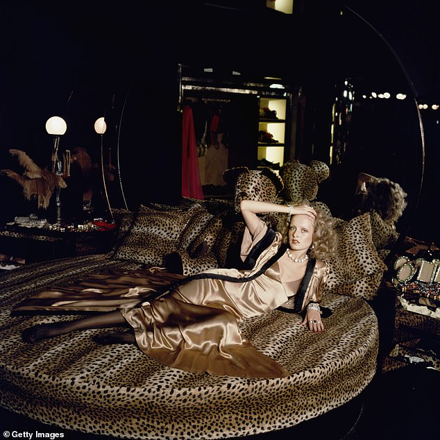 Twiggy pictured lying on a leopard skin bed in the Biba store in Kensington in 1971