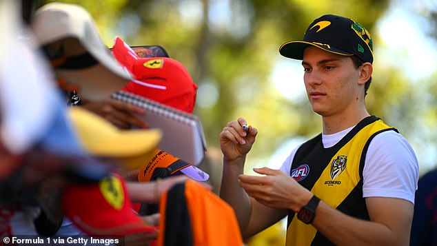 Paistri, 22, posed for pictures with eager fans ahead of this weekend's F1 Grand Prix at Melbourne's Albert Park, proudly wearing Richmond's famous yellow and black colors