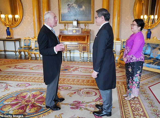 Harry's father King Charles III at Buckingham Palace yesterday where he met Singapore's High Commissioner to the UK, Ng Teck Hean, who was joined by his wife, Mok Ling Ling