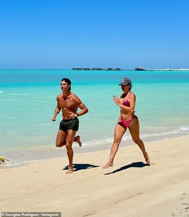 Her and the football icon were snapped during a grueling beach run along the coastline as they both showed off their incredibly toned figures