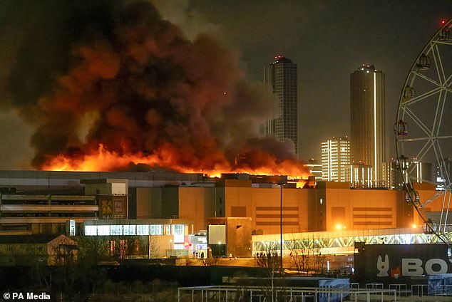 A massive fire is seen above Crocus Town Hall on Friday night after the terrorist attack