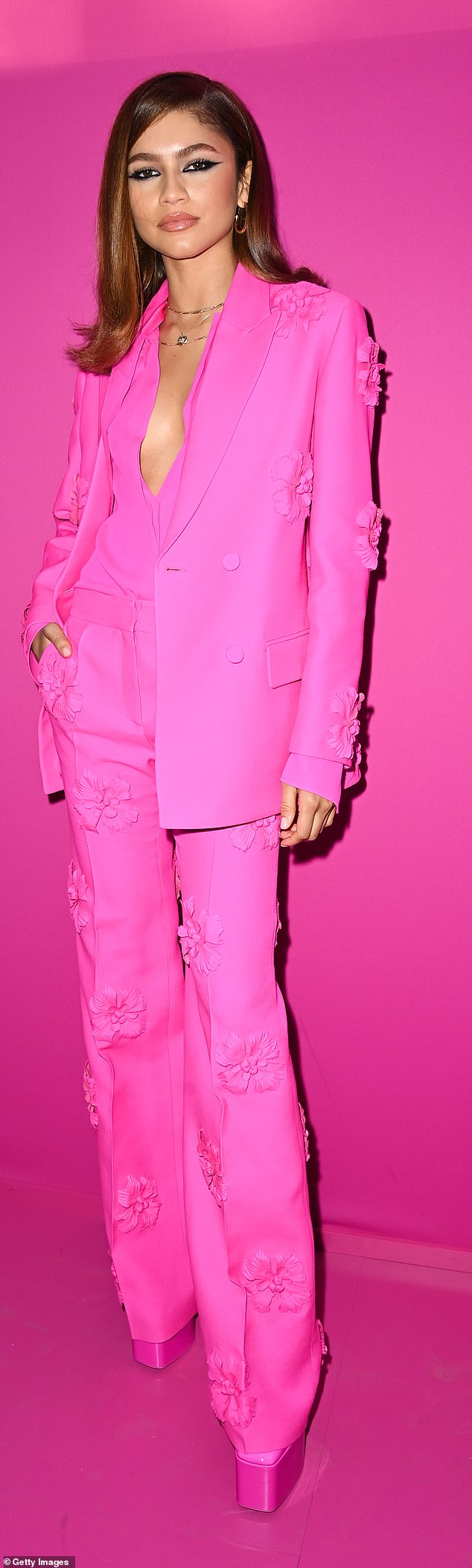 Zendaya (pictured) is pictured wearing hot pink at the 2022 Paris Fashion Week in Paris, France