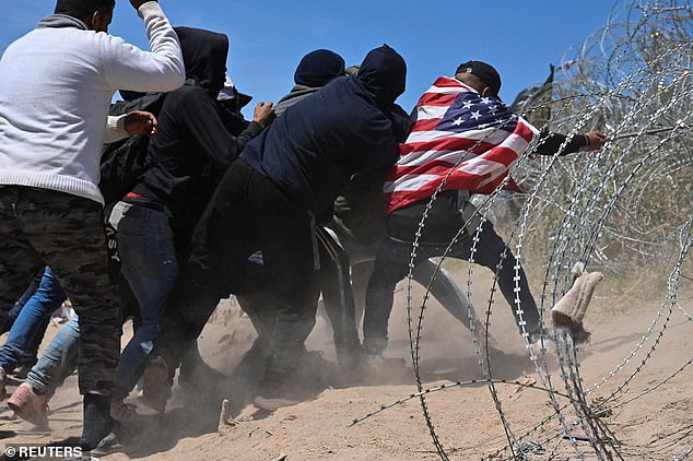 Several groups tried to tear down the razor wire a day later at the border