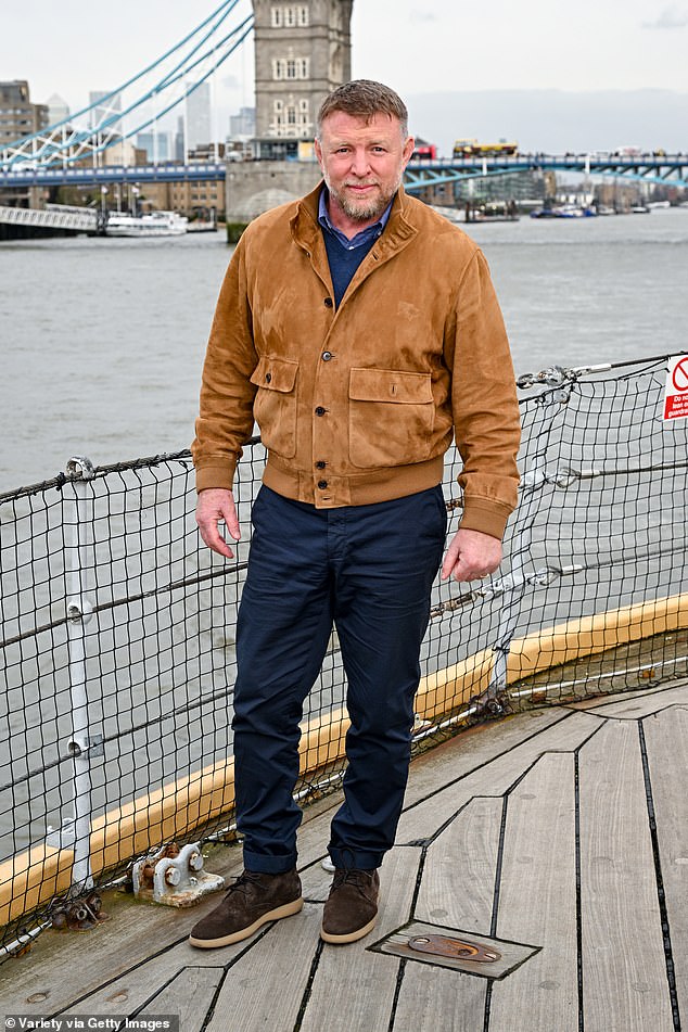 Hollywood alum Guy, 55, opted for a more relaxed look and pulled together in a camel jacket and denim