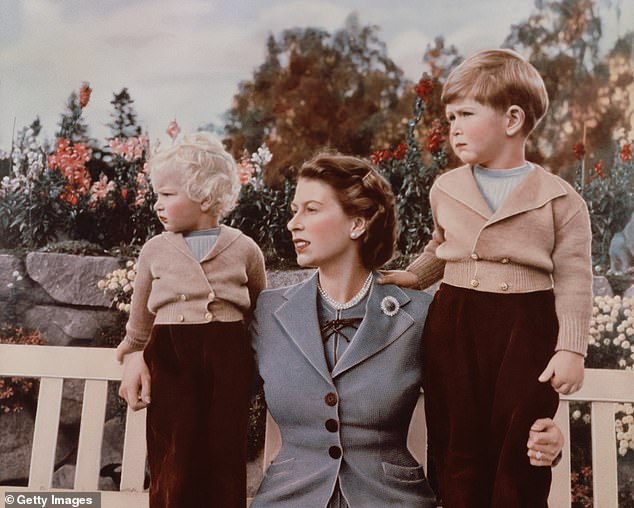 The late Queen Elizabeth was pictured with her children, Princess Anne and now King Charles, in 1952 sitting outside in the grounds of Balmoral Castle.