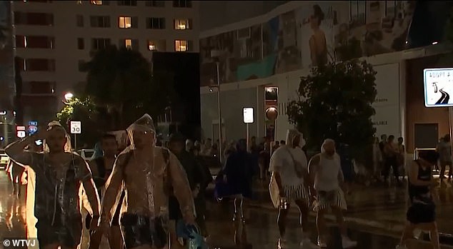 The Ultra Music Festival in Bayfront Park was forced to close early Friday night, leaving Spring Break clubgoers walking home through flooded streets.