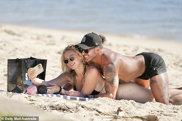 The controversial couple were also seen lying close to each other in the sand before Tori took a selfie, capturing the moment of relaxation and fun.