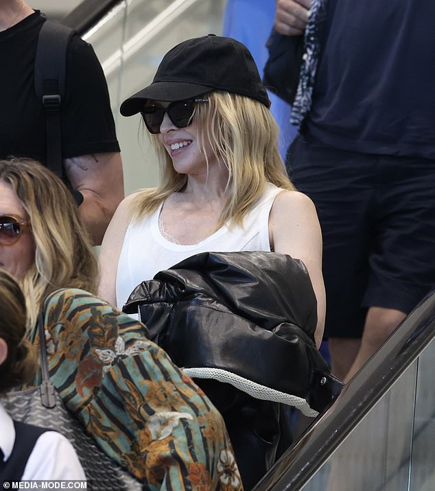 The Australian pop royalty, 55, looked like a woman half her age as she went makeup-free for the flight.