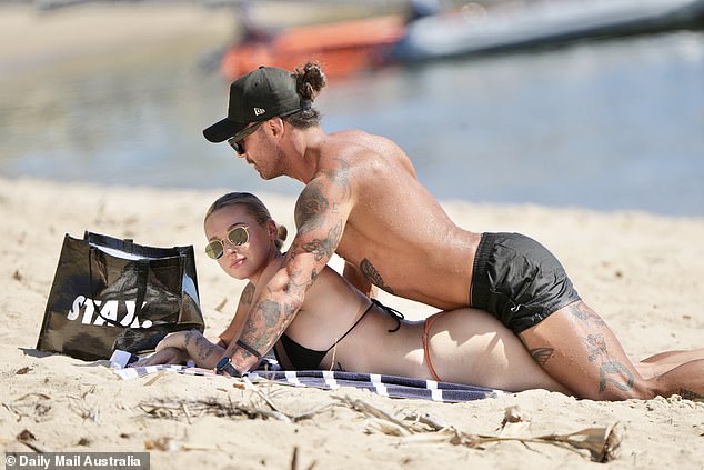 The couple could barely keep their hands off each other as they enjoyed a romantic day on the beach.