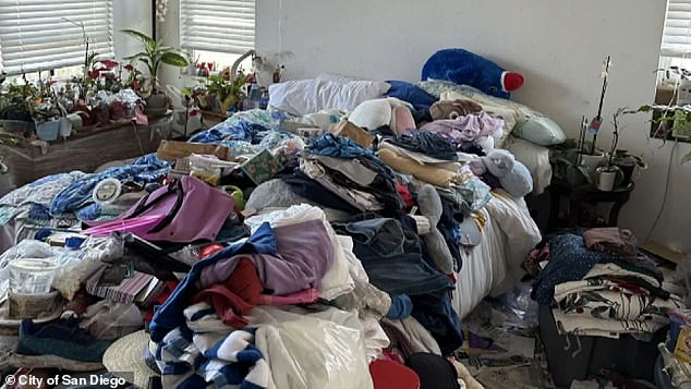 Piles of clothes in the bedroom of the house