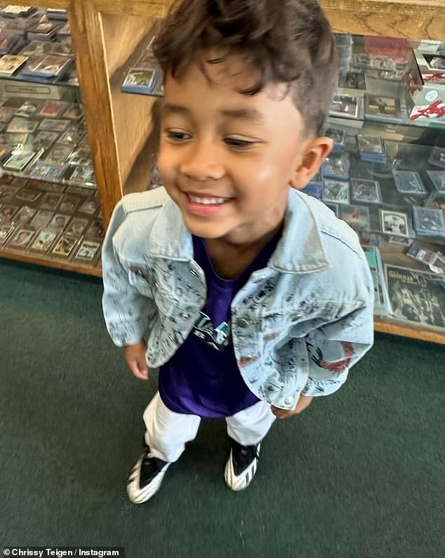 The influencer's latest photos showed her five-year-old son Miles smiling while standing in the middle of a vintage video game store.