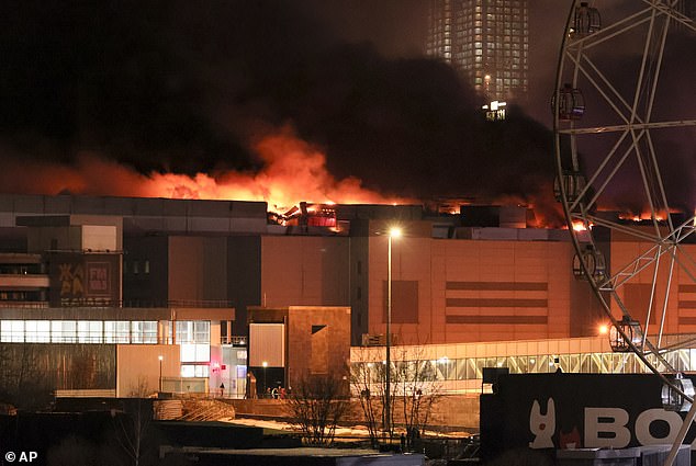 A massive fire is seen above Crocus City Hall in Moscow's western suburbs, 12 miles from the Kremlin.