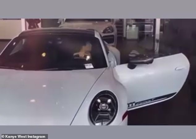 The couple was filmed visiting a car dealership, and Censori is seen sitting inside a white Porsche.