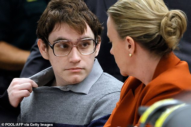 Cruz was sentenced to life in prison after the jury said they could not unanimously agree that the killer, pictured with Deputy Public Defender Melisa McNeill, should be executed.