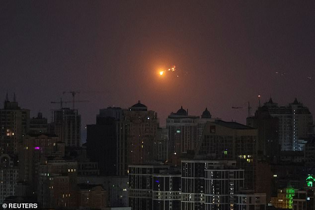 A missile explosion is seen in the sky over kyiv during a Russian missile attack on March 24.