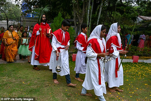 Worshipers holding palm leaves during a Palm Sunday procession in India today