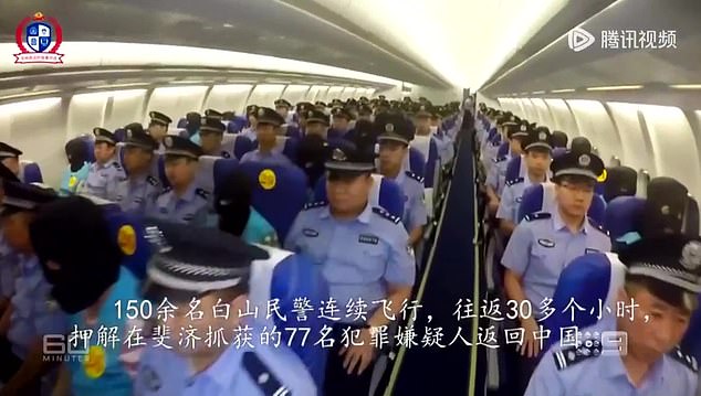 The alleged criminals are then hooded, handcuffed and seated amid row after row of Chinese police officers as they are taken back to China on a charter plane (pictured).