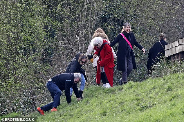 The Sex and the City star, 58, and her actor husband of 27 years, Matthew, were photographed slipping and sliding on a hill as they struggled to reach the top.