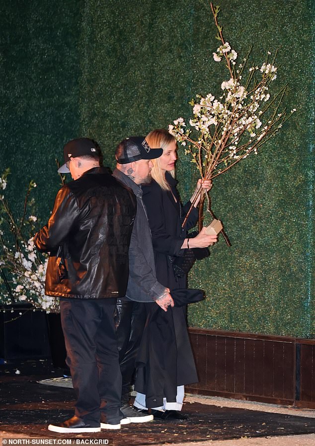 Four-time Golden Globe nominee Cameron Diaz, who is in the midst of her Hollywood comeback, clutched a branch of flowers alongside her husband Benji Madden, with whom she just welcomed her second child (her son Cardinal) to through a surrogate.