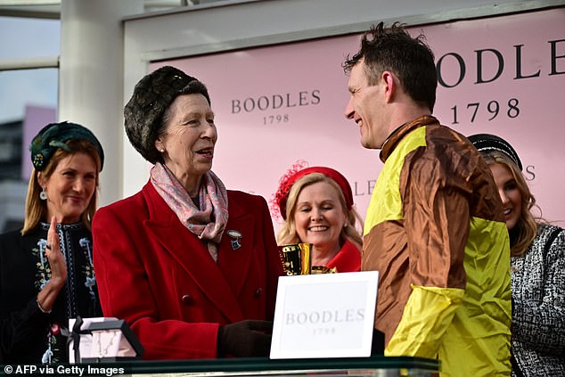 Pictured: Busy Anne was seen presenting winning jockey Paul Townend with a trophy at Cheltenham last week.