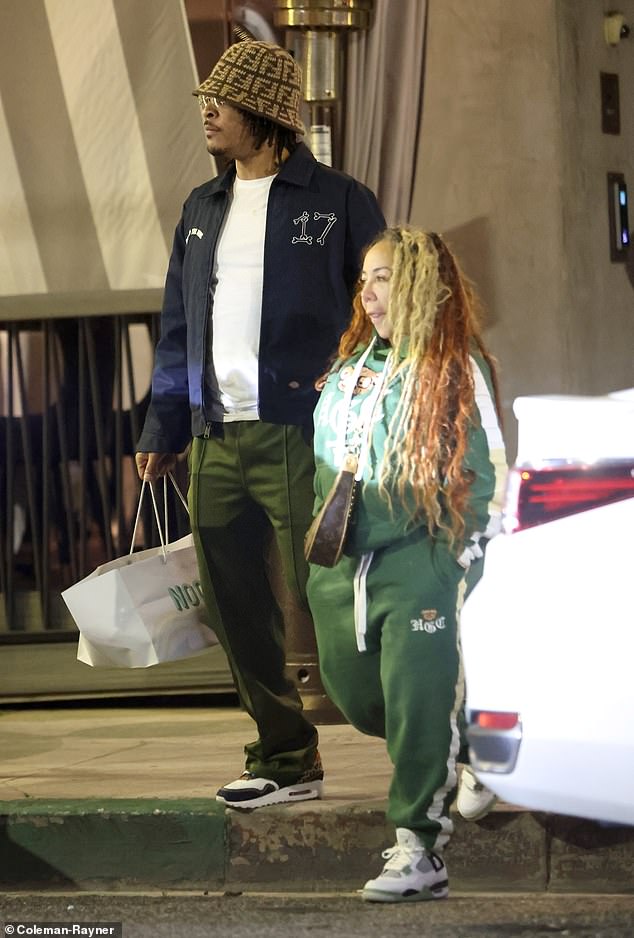 The rapper, 43, wore a blue jacket, white T-shirt, olive green pants and Nike Air Max sneakers, and finished off his look with a Fendi bucket hat, while Tiny, 48, wore a green tracksuit and wore a Louis Vuitton. briefcase