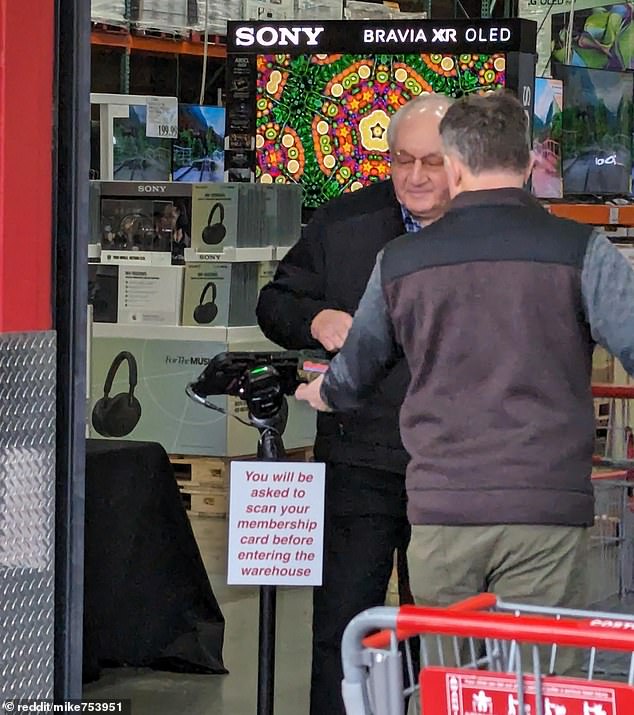 Pictured is a setup at the entrance to a Costco warehouse in Issaquah, Washington, that allows a store employee to view the photo associated with a membership card.