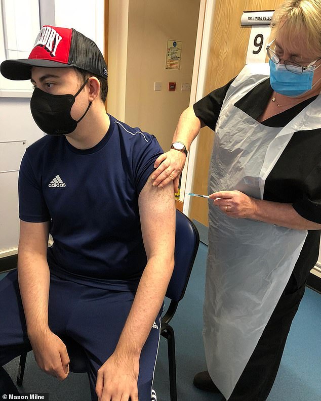 Mason was diagnosed with Crohn's disease in 2017, meaning he is at much higher risk of severe illness if he contracts Covid-19. In the photo, the 22-year-old receives one of the AstraZeneca injections.
