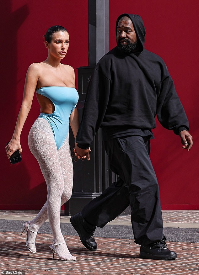 For his part, the Yeezy designer wore an all-black ensemble consisting of a hoodie layered over a t-shirt.