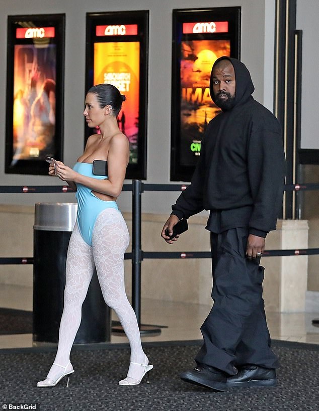 West added parachute pants and a pair of black Nike Air Force One sneakers.