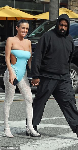 Kanye and Bianca held hands as they crossed a street at the outdoor mall.