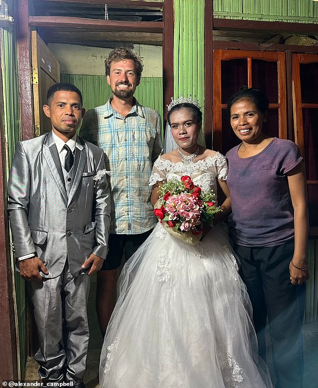 Alexander was even invited to a wedding during his trip. He is pictured above with a bride and groom in Flores, Indonesia.