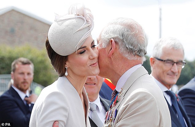 Charles greets Kate at a Commonwealth war graves cemetery in Ypres, Belgium, in July 2017.