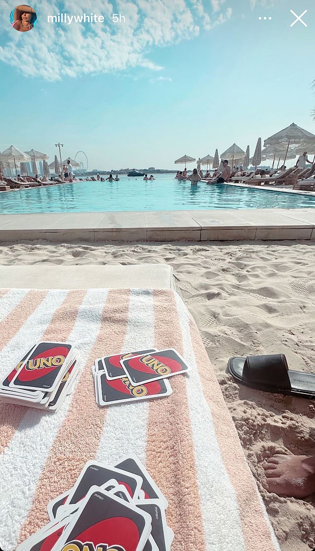 White's wife, Milly, shared a photo of the couple playing Uno in a picturesque setting while on vacation.