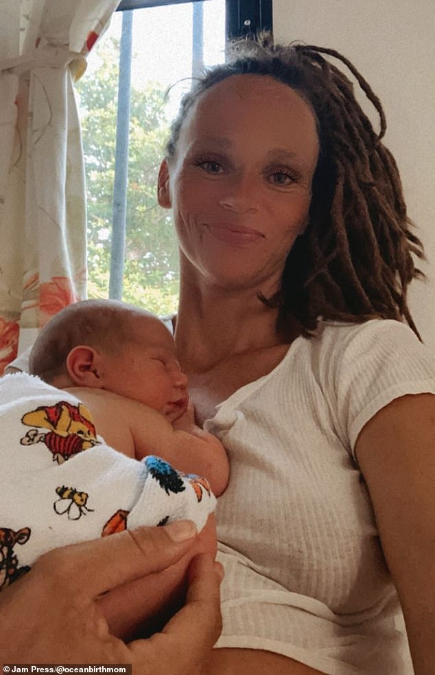 Josy (pictured with Maui) believes in 'free birth' - welcoming a child without the help of medical professionals.