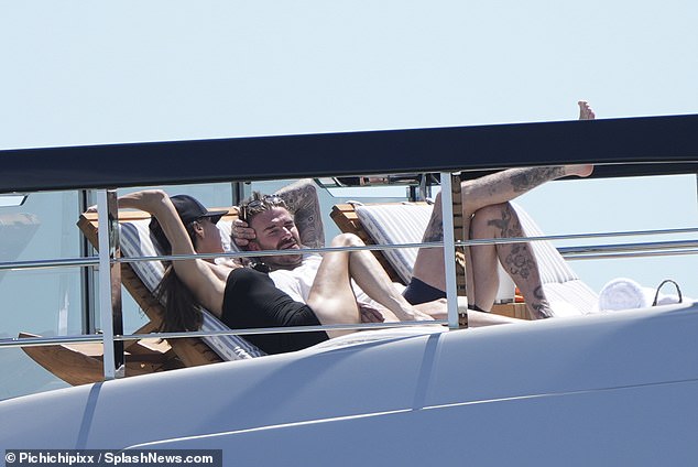 She sunbathed on the upper deck with her husband while the yacht staff attended to her every need.