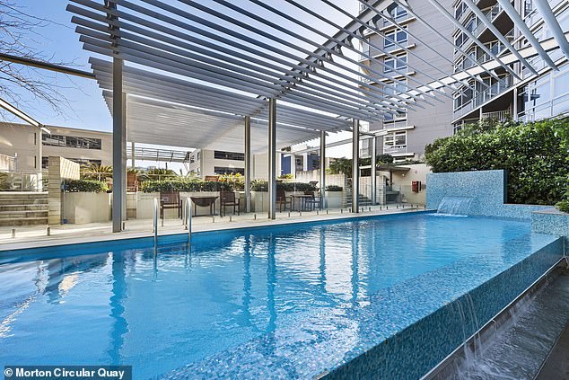 Their apartment block has a swimming pool (pictured), a gym and is located on Sydney Harbour.