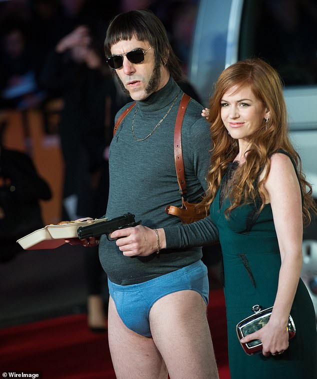 Cohen, dressed in character, and his wife Fisher attend the world premiere of Grimsby in 2016