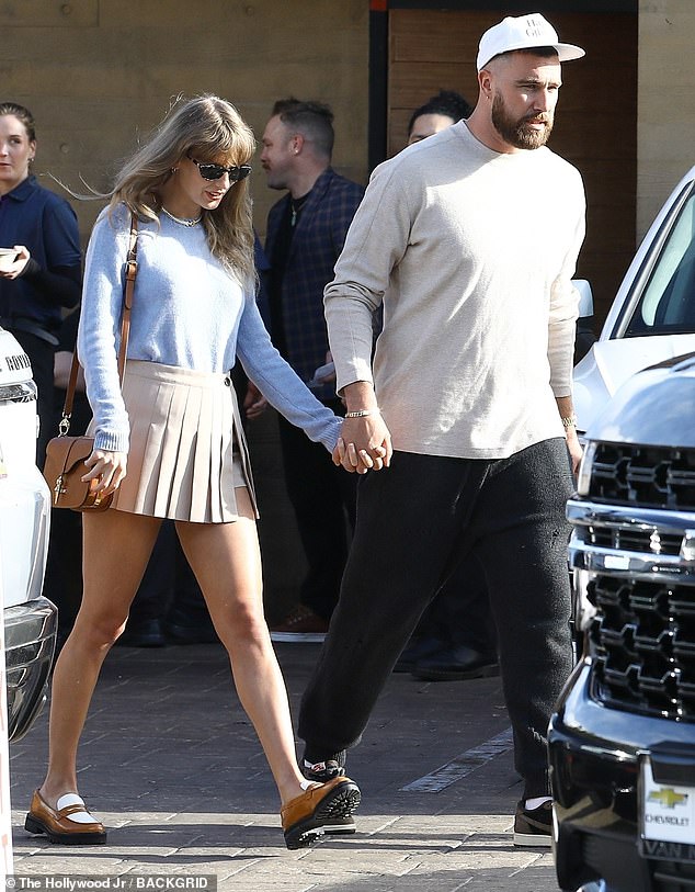 Taylor Swift is seen holding fans with her boyfriend Travis Kelce following a lunch date in Los Angeles following her trip to the Bahamas.