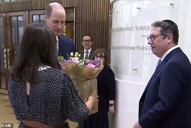 Karen Pollock, executive director of the Holocaust Educational Trust, gave William a bouquet of flowers for Kate while they were with Rabbi Daniel Epstein.